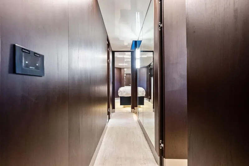 Alter Ego Yacht Photos Pics Luxurious hallway inside 2018 Ferretti Yachts 850 Motoryacht, featuring sleek wood paneling.