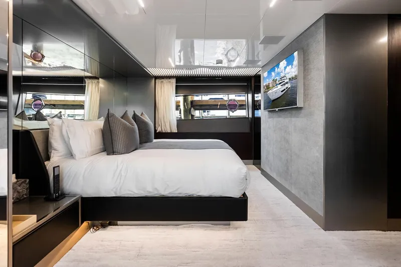 Alter Ego Yacht Photos Pics Luxurious bedroom interior of 2018 Ferretti Yachts 850 Motoryacht with modern decor and TV.