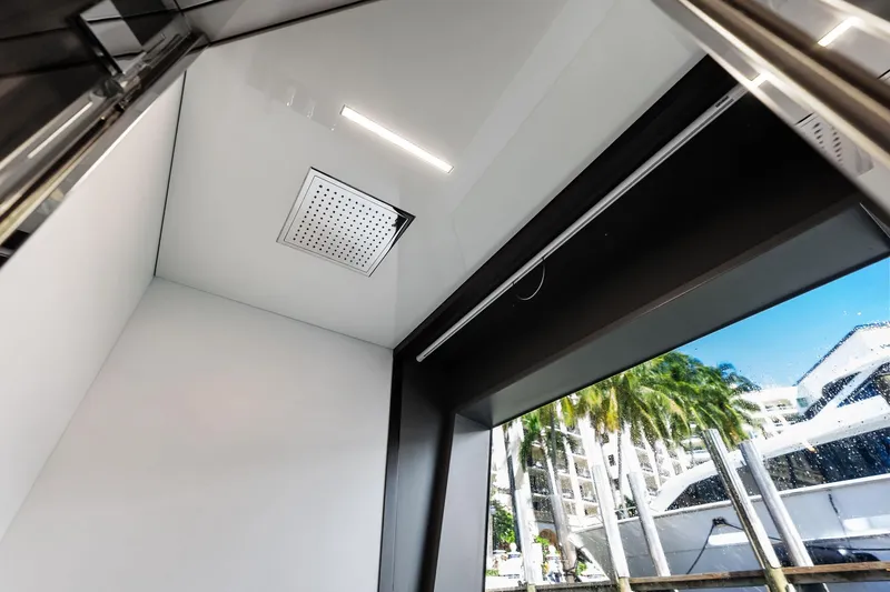 Alter Ego Yacht Photos Pics Interior view of 2018 Ferretti Yachts 850 Motoryacht with modern shower and window.