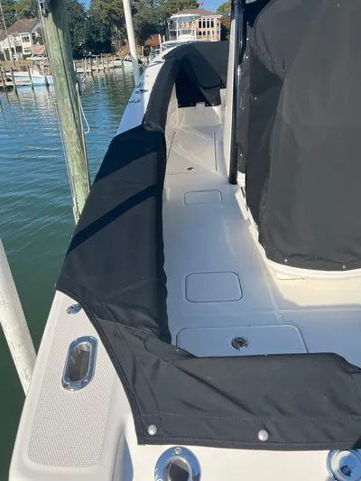  Yacht Photos Pics 2023 World Cat 280 CC-X boat with black cover at dock.