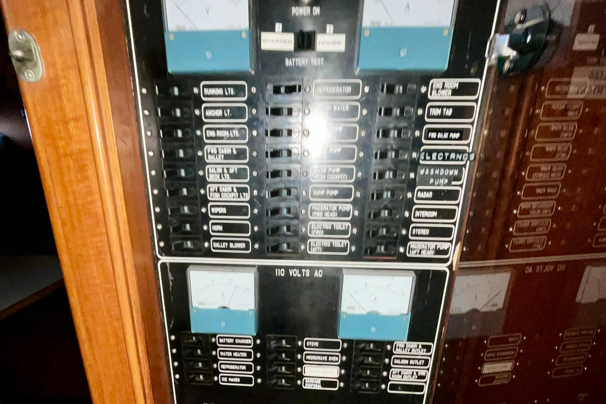 Electrical panel of 1987 Lien Hwa 47 Cockpit Motor Yacht, showing various switches and controls.