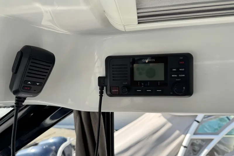 Plumper Yacht Photos Pics Garmin radio system inside 2019 Jeanneau NC 895 boat cockpit.