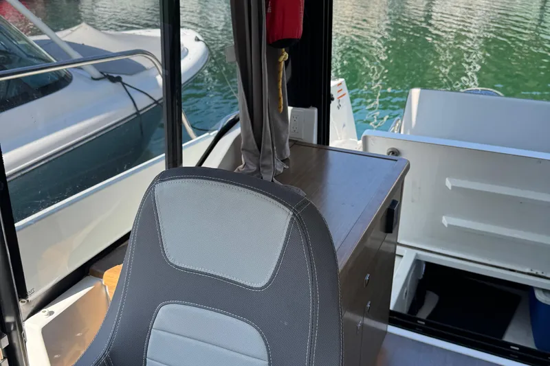Plumper Yacht Photos Pics Interior of 2019 Jeanneau NC 895 boat with seating and water view.