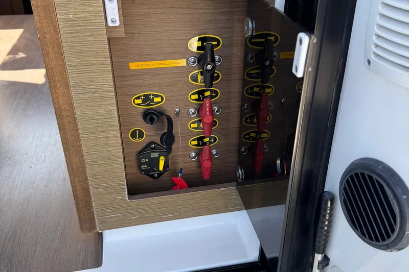 Plumper Yacht Photos Pics Electrical panel on 2019 Jeanneau NC 895 boat, featuring switches and controls.