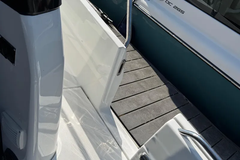 Plumper Yacht Photos Pics 2019 Jeanneau NC 895 boat with open side door and dock view.