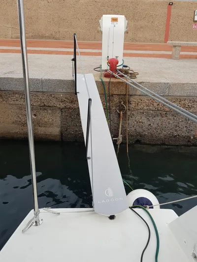 Kaya Yacht Photos Pics Lagoon 42 catamaran docked with gangway, 2021 model, at a marina.