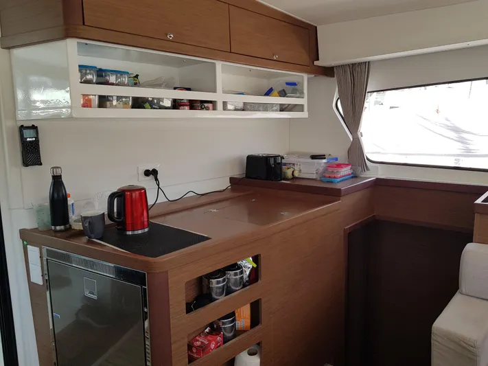 Kaya Yacht Photos Pics Interior of 2021 Lagoon 42 yacht kitchen with modern amenities and storage.