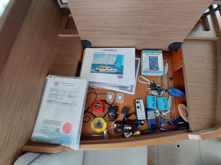 Kaya Yacht Photos Pics Drawer with Lagoon 42 manual, keys, and various tools, 2021 model.