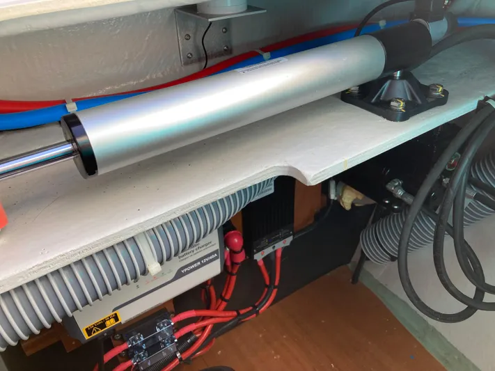 Kaya Yacht Photos Pics Engine compartment of a 2021 Lagoon 42 catamaran, showcasing mechanical components and wiring.