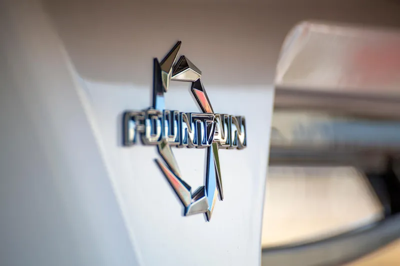  Yacht Photos Pics 2025 Fountain 38 SCX logo on boat hull, close-up view.