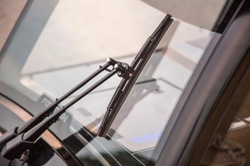  Yacht Photos Pics Close-up of 2025 Fountain 38 SCX windshield wiper on a sleek glass surface.