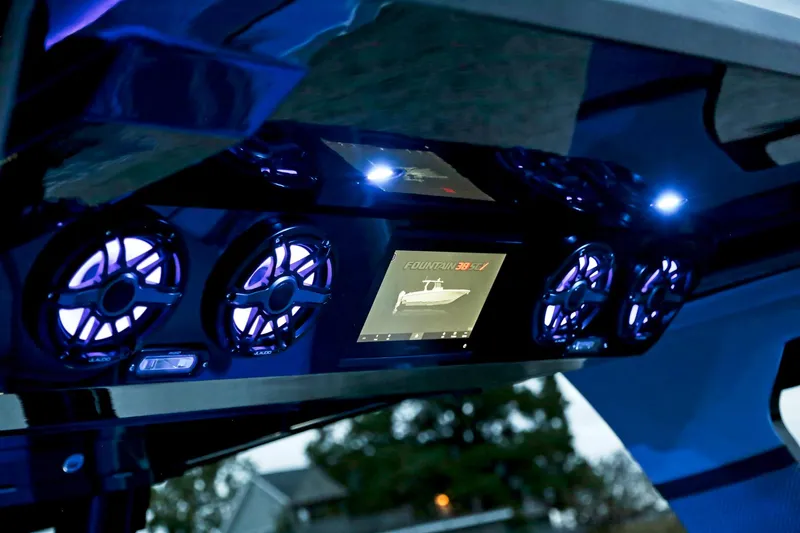  Yacht Photos Pics Fountain 38 SCX 2025 boat dashboard with illuminated controls and display screen.