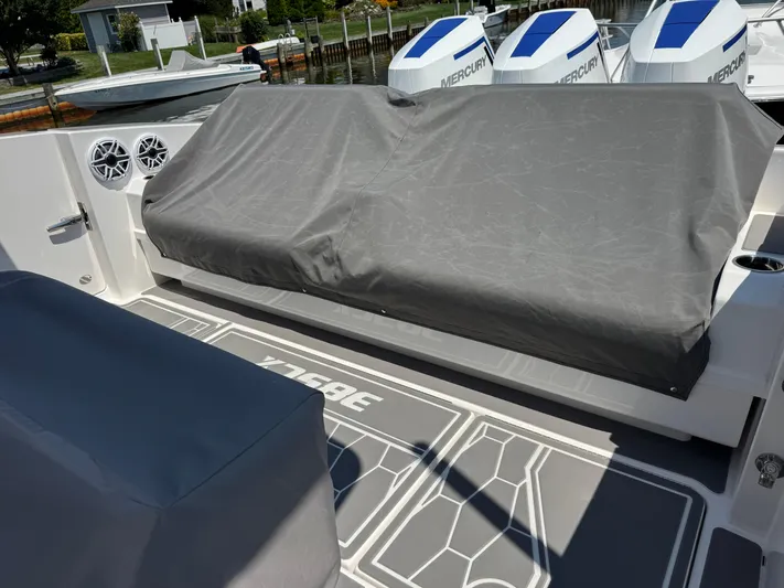  Yacht Photos Pics 2025 Fountain 38 SCX boat deck with covered seating and Mercury engines.