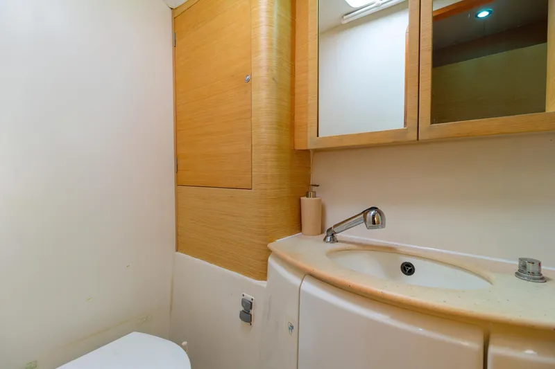 Agm26a09z3354 Yacht Photos Pics Bathroom interior of 2010 Lagoon 440 yacht with sink and mirror.