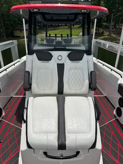  Yacht Photos Pics 2024 Fountain 32 NX boat interior with dual seats and modern design.