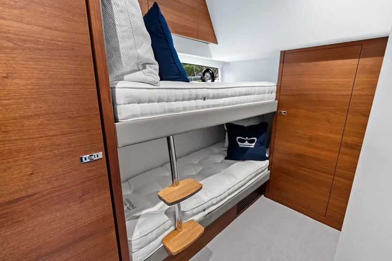 Hullabaloo Yacht Photos Pics Interior of 2021 Princess V55 yacht with wooden bunk beds and modern design.