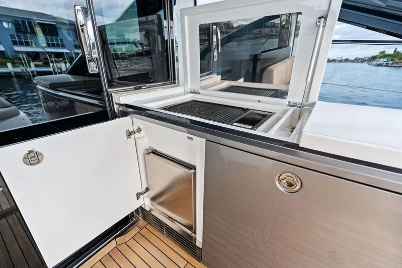 Hullabaloo Yacht Photos Pics Outdoor kitchen on 2021 Princess V55 yacht with grill and storage.