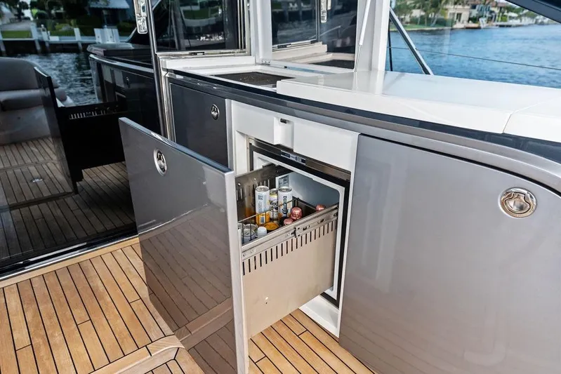 Hullabaloo Yacht Photos Pics Luxury yacht Princess V55 2021 with open mini fridge on deck.