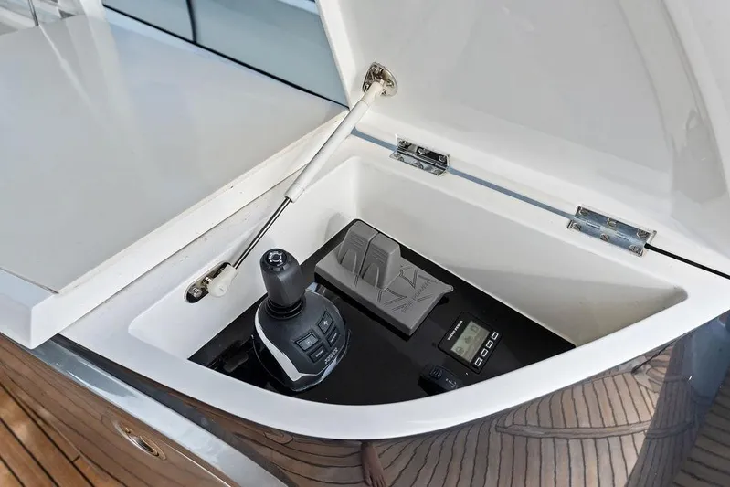 Hullabaloo Yacht Photos Pics Control panel of 2021 Princess V55 yacht, featuring joystick and digital display.