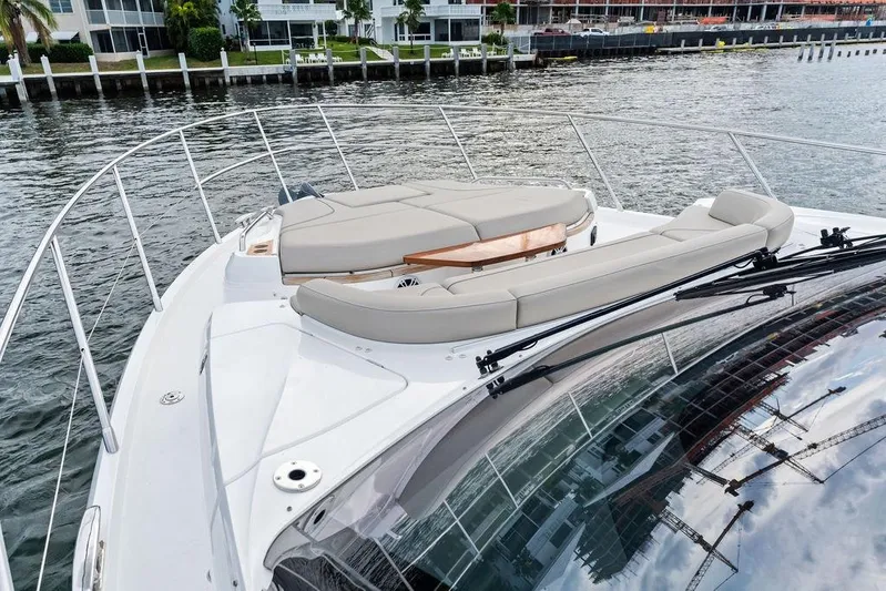 Hullabaloo Yacht Photos Pics 2021 Princess V55 yacht with luxurious deck seating on calm waters.