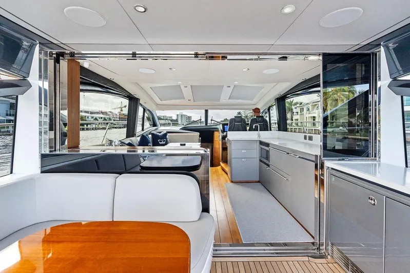 Hullabaloo Yacht Photos Pics Luxurious interior of 2021 Princess V55 yacht with modern design and spacious layout.