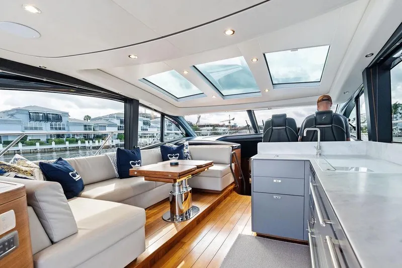 Hullabaloo Yacht Photos Pics Luxurious interior of 2021 Princess V55 yacht with skylights and modern furnishings.
