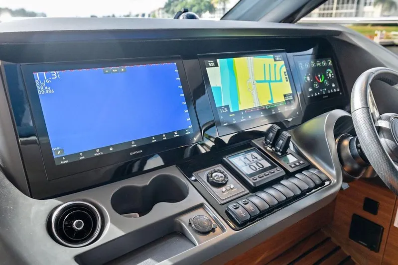 Hullabaloo Yacht Photos Pics Cockpit of 2021 Princess V55 yacht with advanced navigation displays and controls.