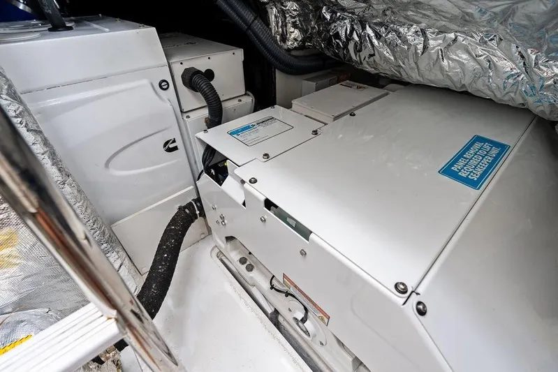 Hullabaloo Yacht Photos Pics Engine room of 2021 Princess V55 yacht with mechanical equipment and insulation.
