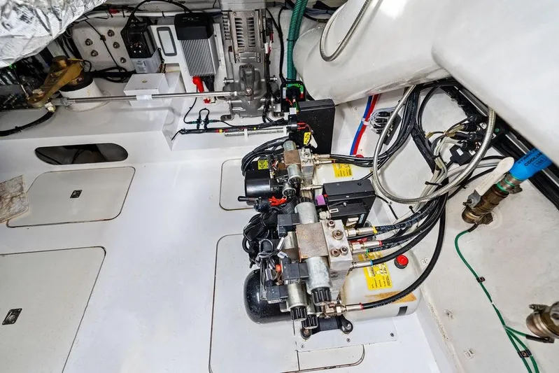 Hullabaloo Yacht Photos Pics Engine room of 2021 Princess V55 yacht, showcasing mechanical components and wiring.
