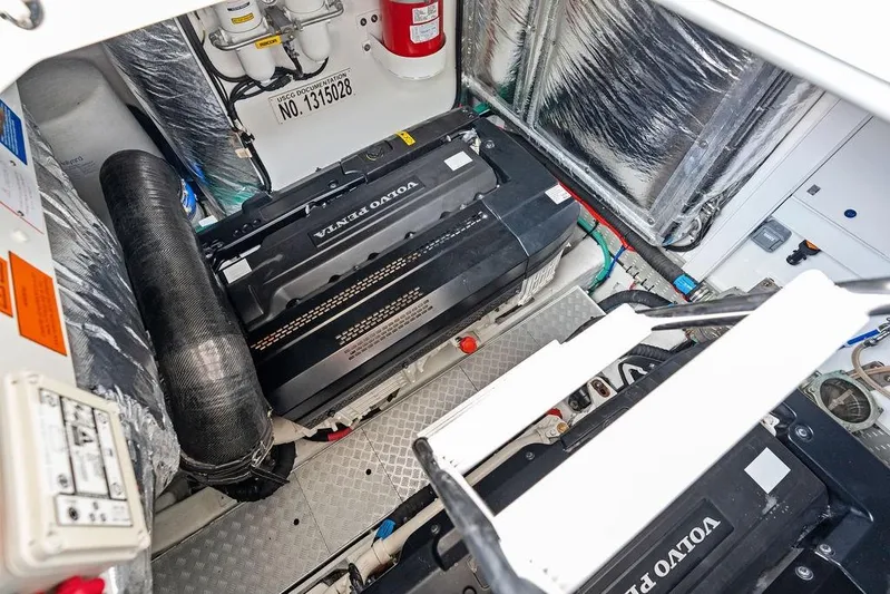 Hullabaloo Yacht Photos Pics Engine room of 2021 Princess V55 yacht featuring Volvo Penta engines and safety equipment.