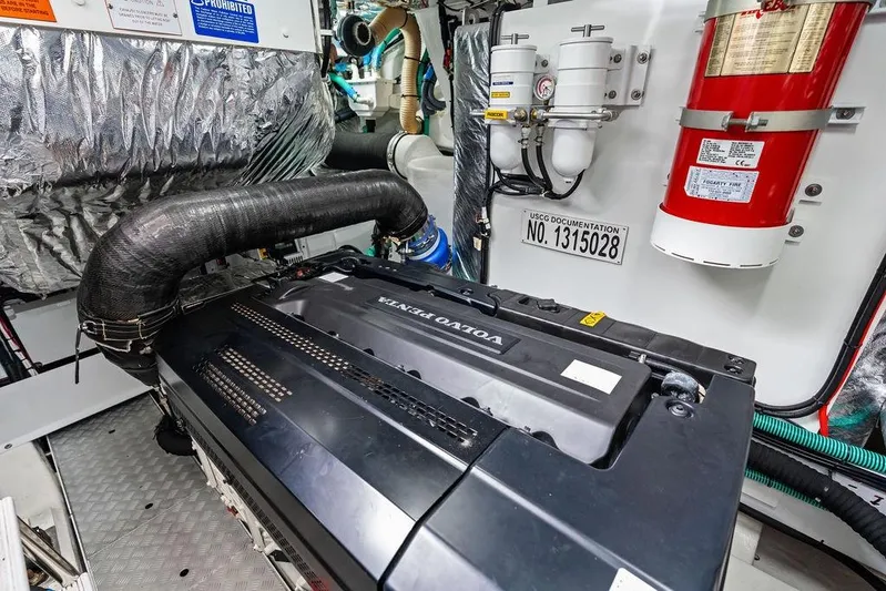 Hullabaloo Yacht Photos Pics Engine room of 2021 Princess V55 yacht with Volvo Penta engine and safety equipment.