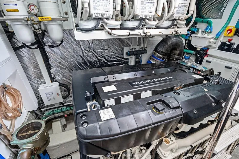 Hullabaloo Yacht Photos Pics Engine room of 2021 Princess V55 yacht featuring Volvo Penta engine components.