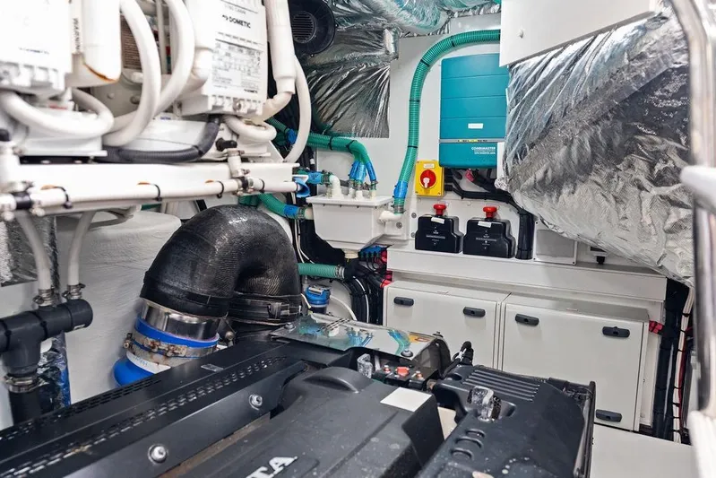 Hullabaloo Yacht Photos Pics Engine room of 2021 Princess V55 yacht, showcasing mechanical components and systems.
