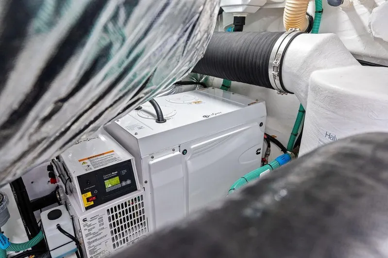 Hullabaloo Yacht Photos Pics Engine room of 2021 Princess V55 yacht with generator and ventilation system.
