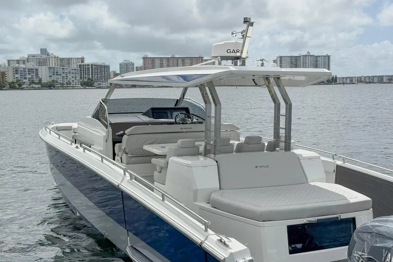  Yacht Photos Pics Luxury Opus OPUS 12 boat, 2024 model, docked with city skyline in background.