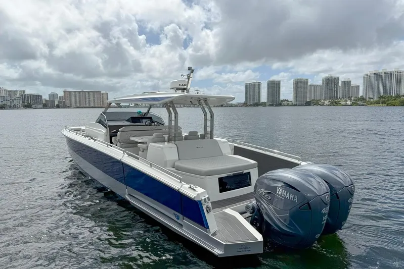  Yacht Photos Pics 2024 Opus OPUS 12 boat with Yamaha engines on a city waterfront.
