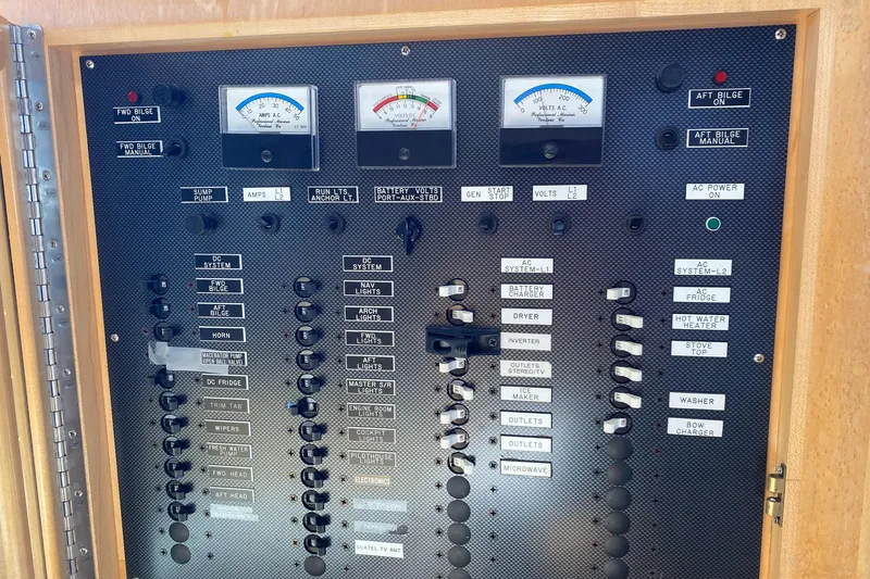 Coldwater Fusion Yacht Photos Pics Electrical control panel of a 1998 Navigator 5300 Classic yacht with labeled switches and gauges.