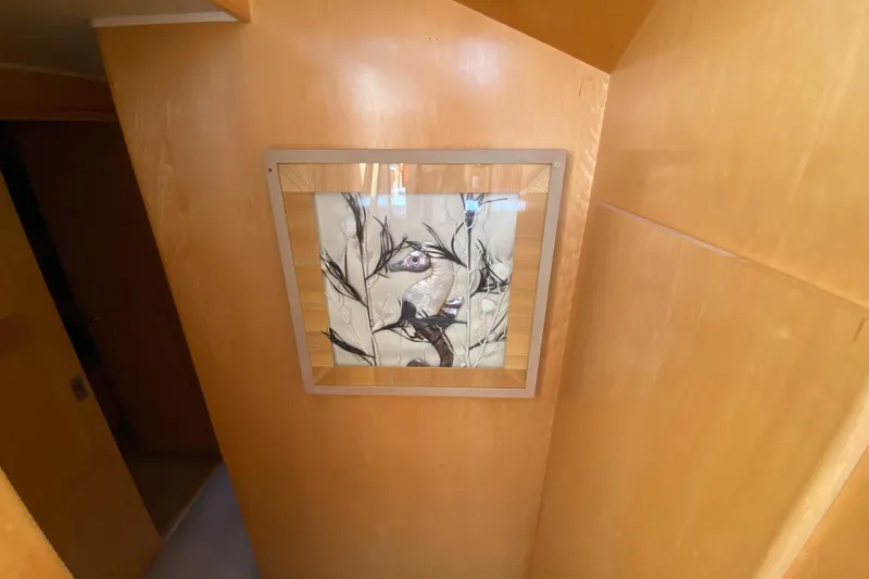 Coldwater Fusion Yacht Photos Pics Framed abstract art on wooden wall inside 1998 Navigator 5300 Classic yacht.