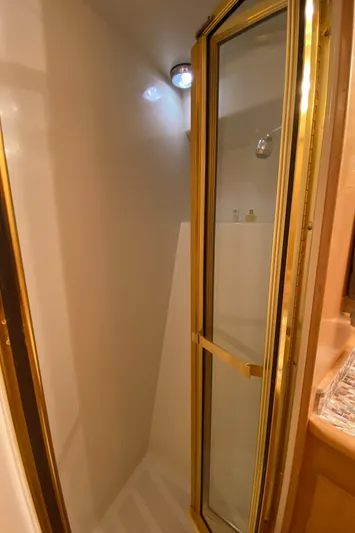 Coldwater Fusion Yacht Photos Pics Shower area with glass door in 1998 Navigator 5300 Classic yacht.