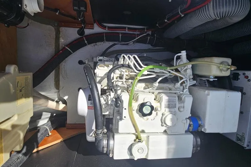 Artemis Yacht Photos Pics Engine compartment of a 2023 Lagoon 46 catamaran, showcasing mechanical components and wiring.