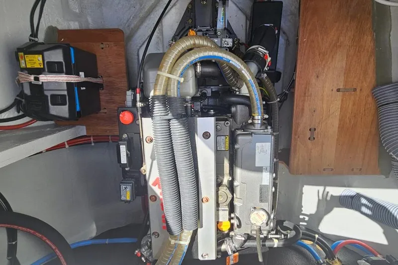 Artemis Yacht Photos Pics Engine compartment of 2023 Lagoon 46 yacht, showcasing mechanical components and wiring.