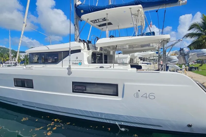 Artemis Yacht Photos Pics 2023 Lagoon 46 catamaran docked, featuring sleek design and modern amenities.