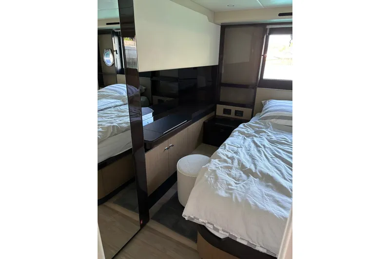  Yacht Photos Pics Luxurious bedroom interior of 2024 Absolute 60 Fly yacht with modern design elements.