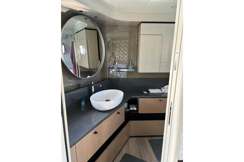  Yacht Photos Pics Luxurious bathroom in 2024 Absolute 60 Fly yacht with modern fixtures and elegant design.