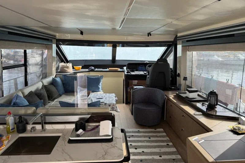  Yacht Photos Pics Luxurious interior of 2024 Absolute 60 Fly yacht with modern furnishings and panoramic windows.