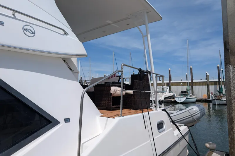 Elena Yacht Photos Pics Bayliner 4088 yacht, 2000 model, docked at marina with outdoor seating area.