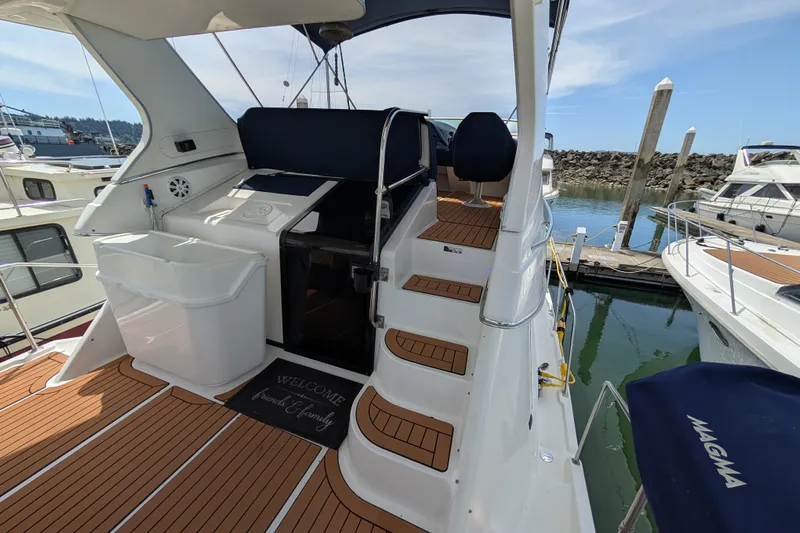 Elena Yacht Photos Pics Bayliner 4088 yacht, 2000 model, featuring teak deck and marina view.