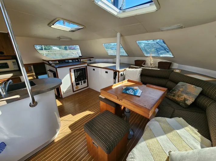  Yacht Photos Pics Spacious interior of 2000 Manta 42 catamaran with seating and navigation area.