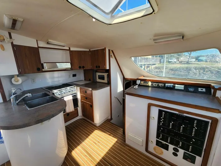  Yacht Photos Pics Interior of 2000 Manta 42 yacht with kitchen and control panel.