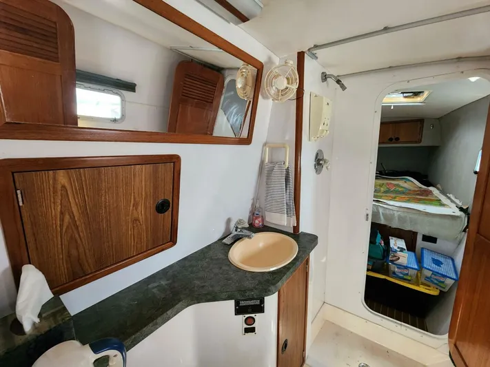  Yacht Photos Pics Interior of 2000 Manta 42 yacht bathroom with sink and mirror.